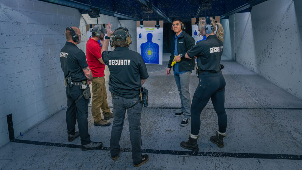 An Armed Guard 2 Day Class Student Raises His Hand To Ask The Pilb Certified Instructor A Question At The Range 702 In Las Vegas