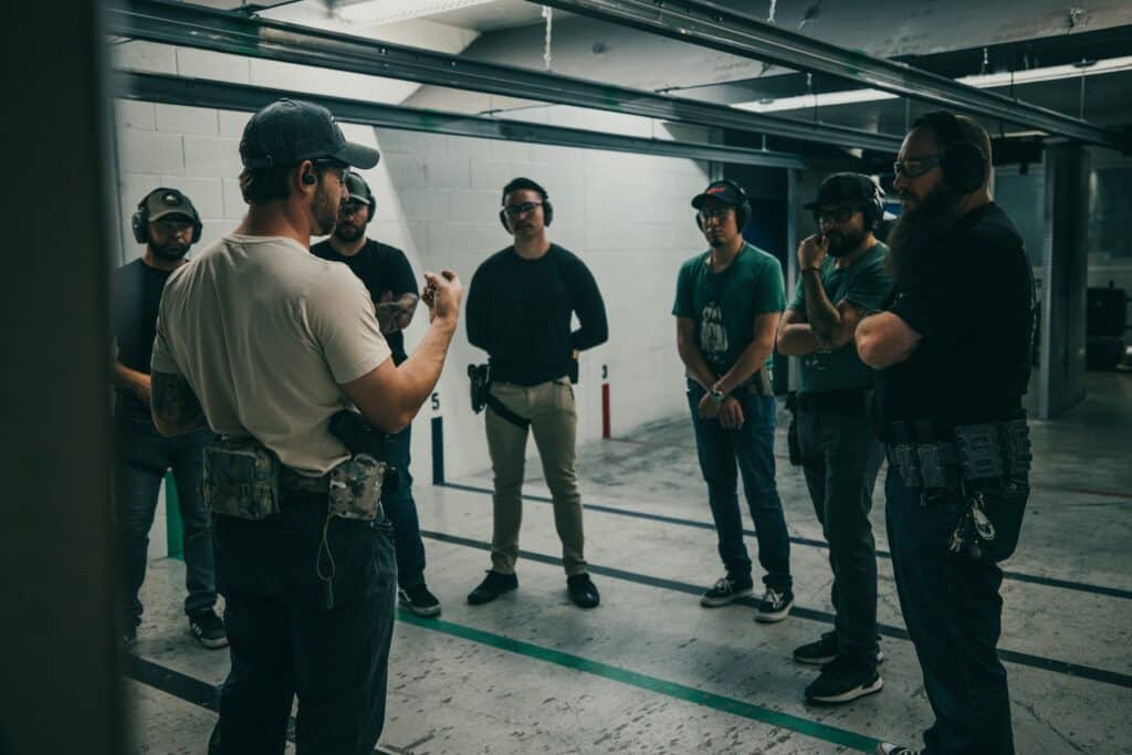 An instructor from The Range 702 in Las Vegas addresses an armed guard class on the range.