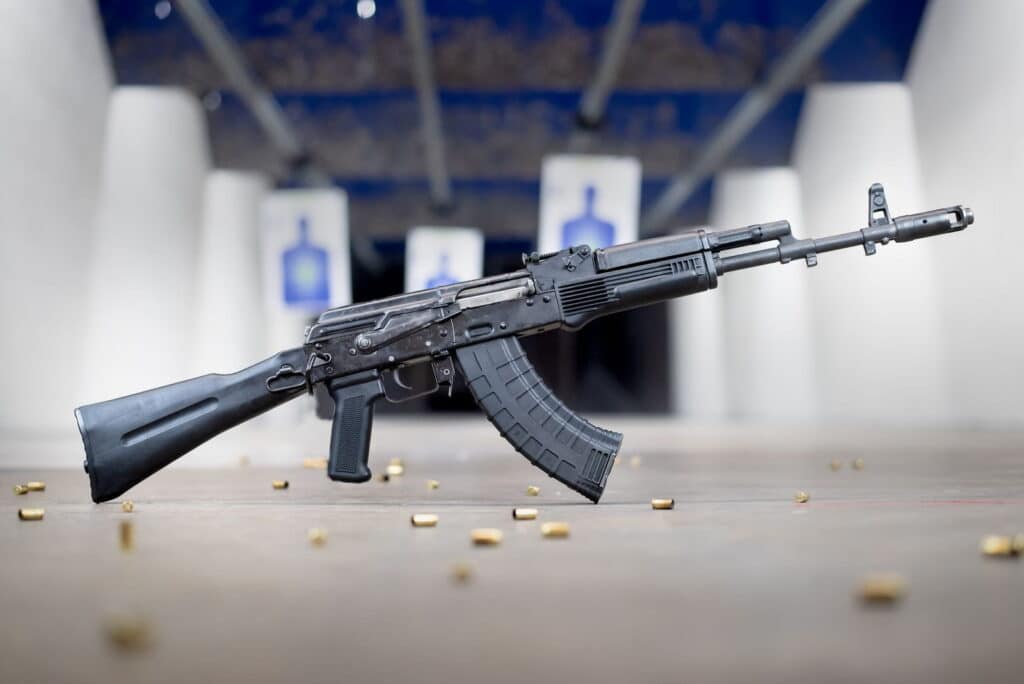 An Ak-47 Positioned In Front Of Targets At The Range 702.