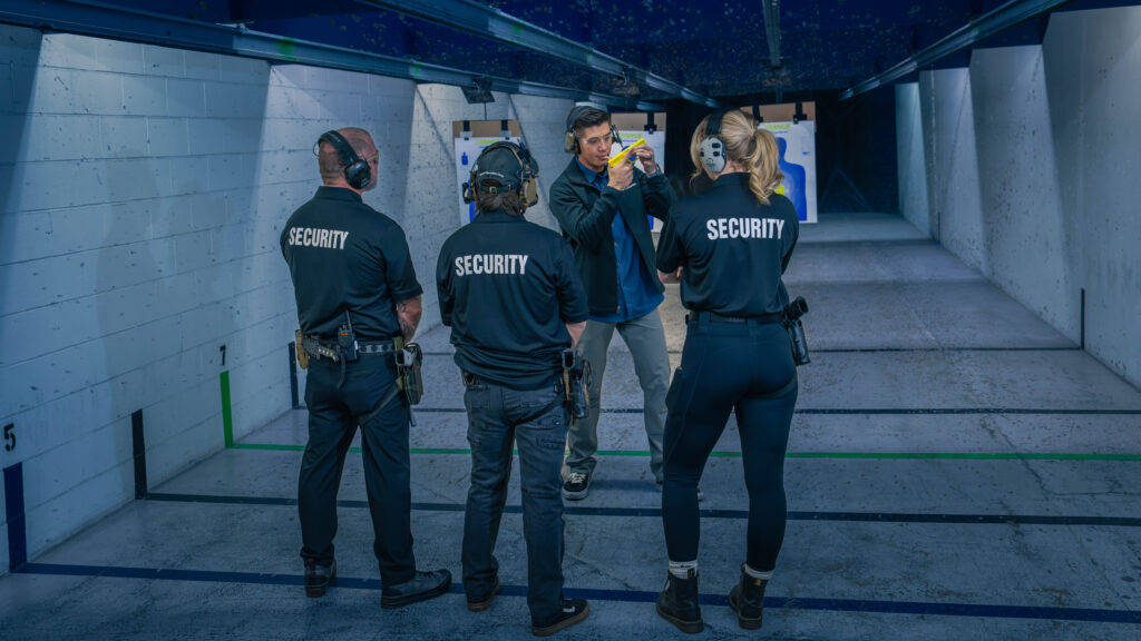 A Pilb Certified Instructor Demonstrates Proper Grip On A Pistol To Students In An Armed Guard Certification Class At The Range 702 In Las Vegas.