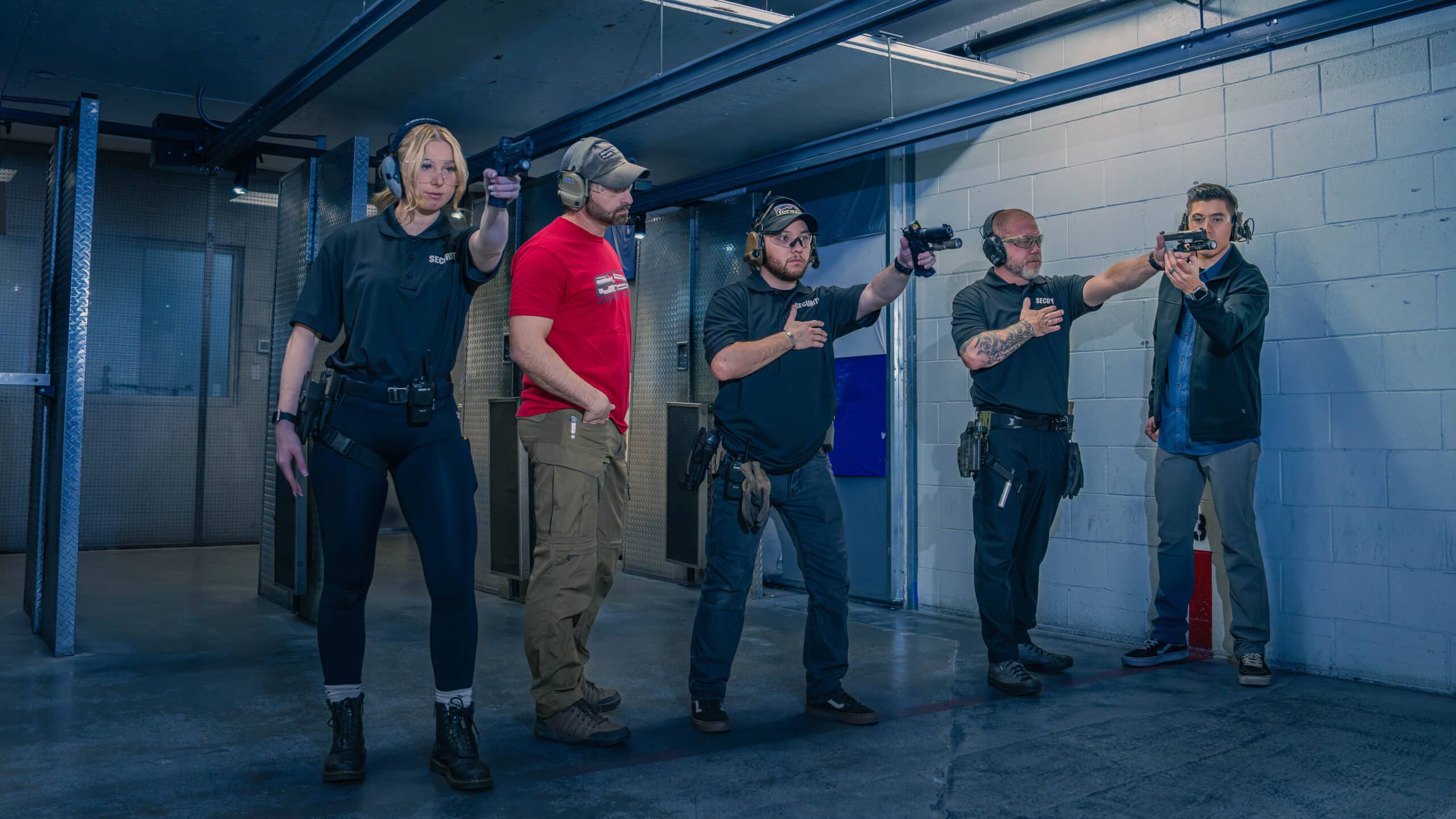 Pilb Certified Armed Guard Instructors Work With Students At The Range 702 In Las Vegas During A Class To Get Their Pilb Armed Work Cards.